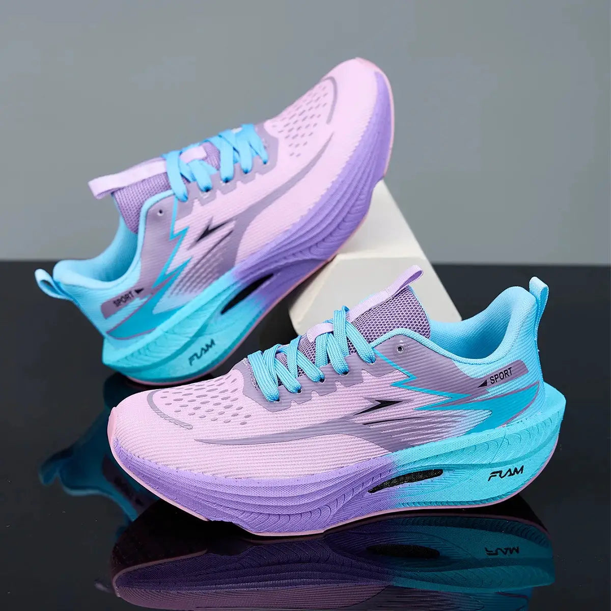 Running shoes in pink, purple and blue gradient; breathable lightweight athletic sneakers with a non-slip outsole pair