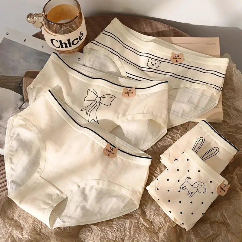 Simples Market 5-piece cotton panties set; white mid-rise briefs with cute cartoon prints.
