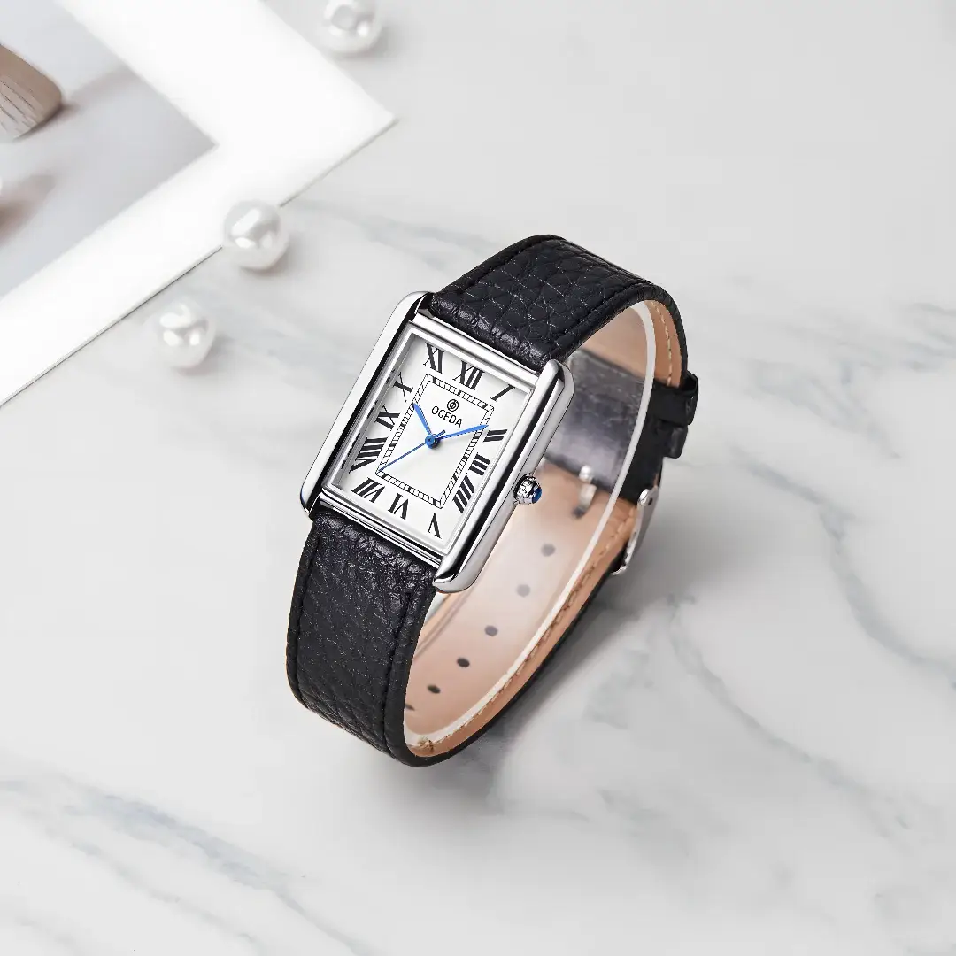 OGEDA couple watch; black leather strap, silver square case, white dial with Roman numerals and blue hands