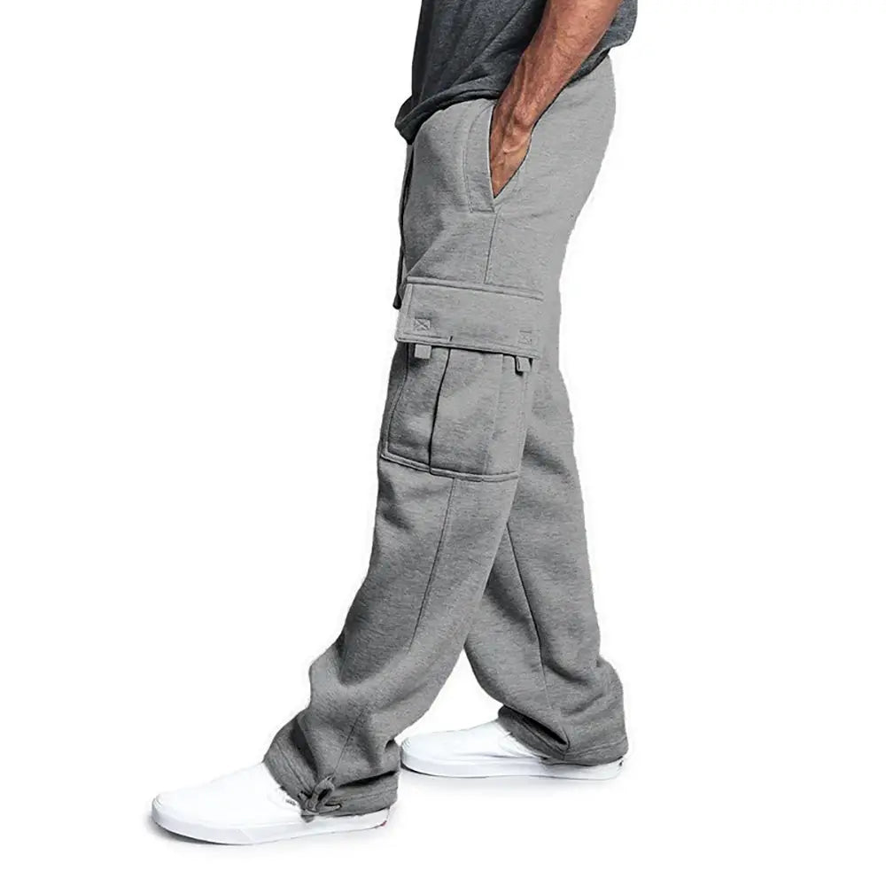 Men's grey loose cargo jogger sweatpants with multiple pockets and drawstring waist.