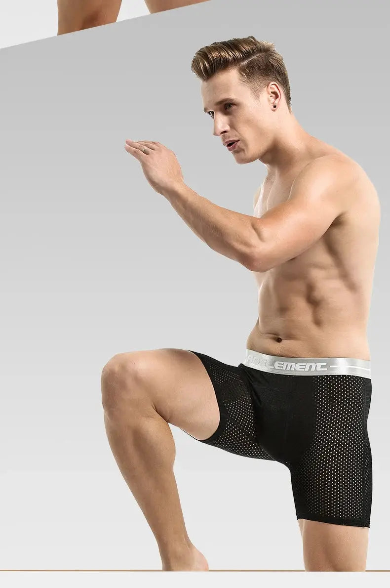 Men's black mesh boxer shorts with silver waistband, athletic mid-thigh underwear.