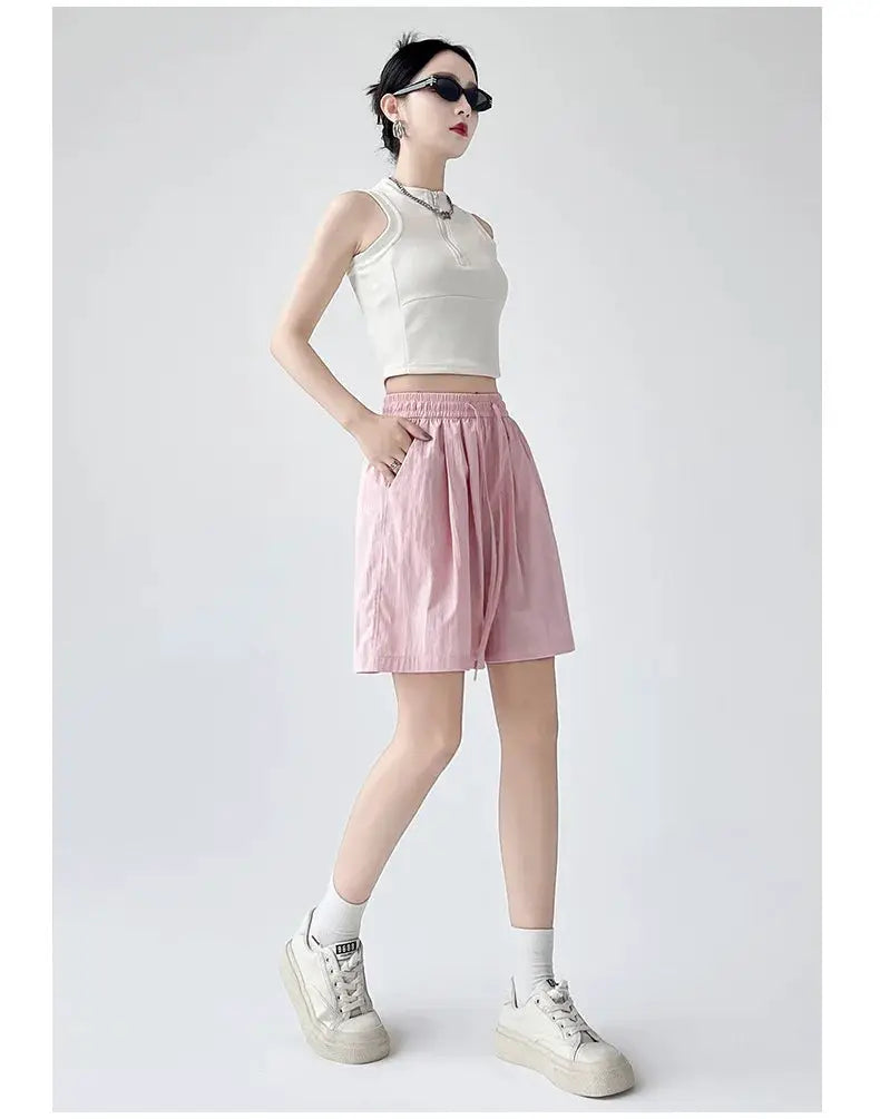 Summer women shorts in pink with elastic high waist and two pockets for casual beachwear