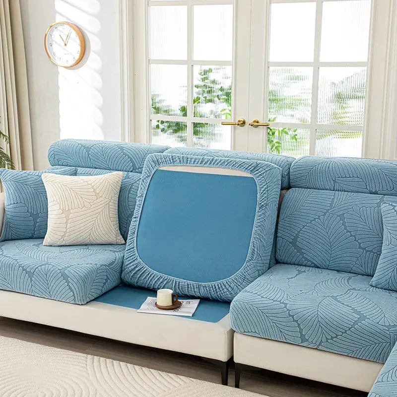 Blue thick-plush sofa cover set with elastic cushion covers for living room, leaf-pattern upholstery.