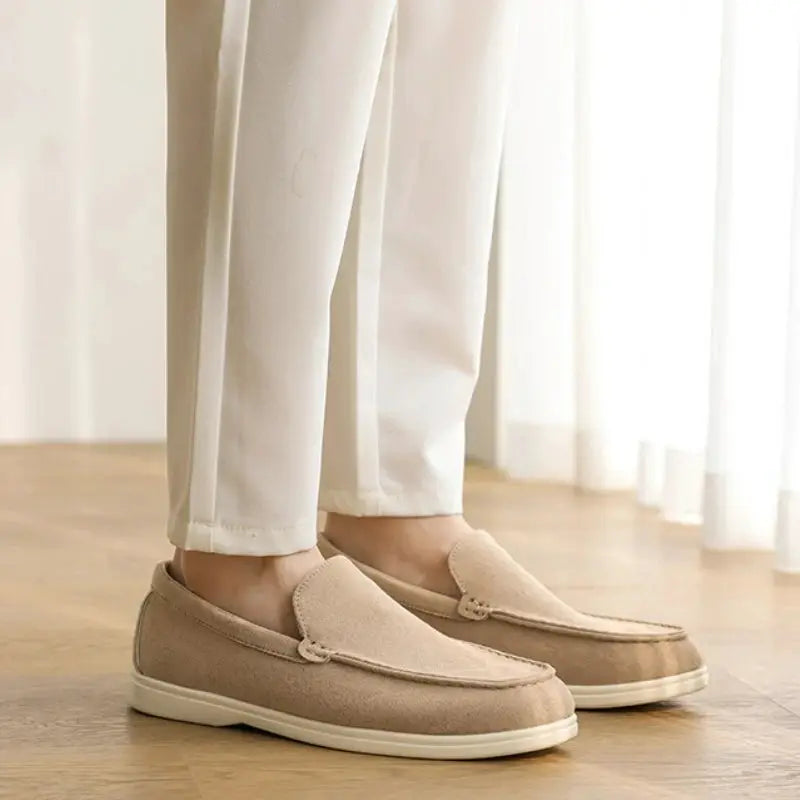 Pair of men's suede loafers, beige slip-on moccasin style with lightweight sole