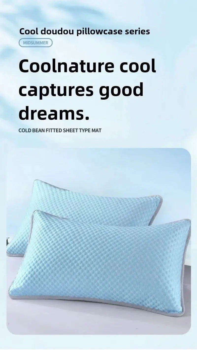 Two light-blue cooling pillowcases with quilted texture and gray piping (48x70 cm).