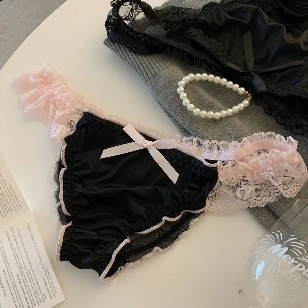 Women's satin lace panties with pink ruffle trim and bow, low-rise briefs.