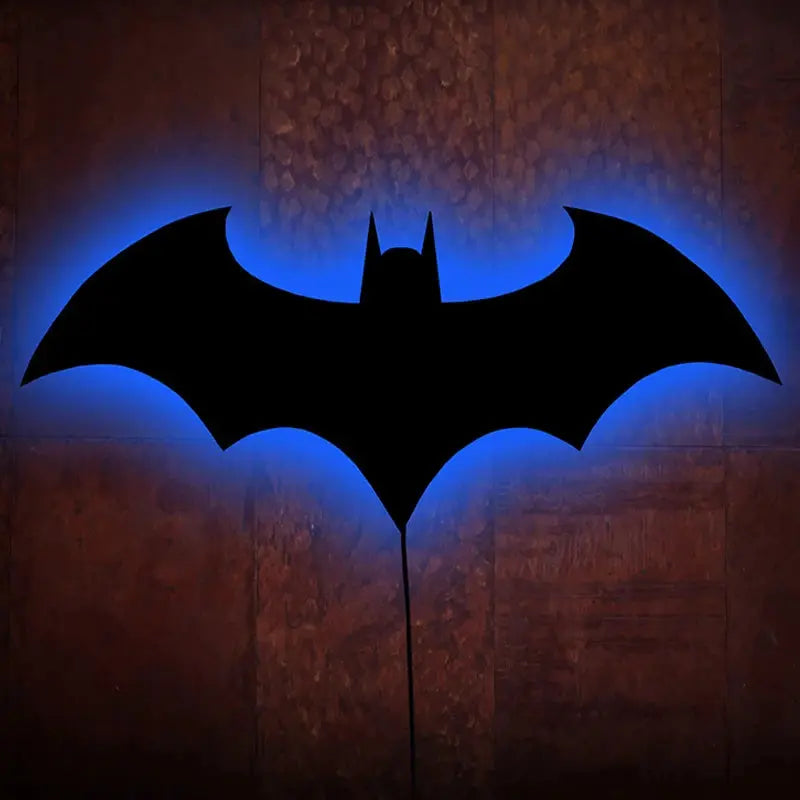 Bat-shaped wooden LED wall lamp with blue backlight, ideal for bedroom or living room decor