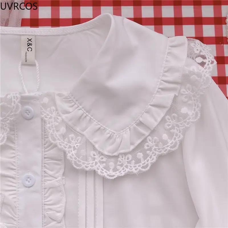 White Lolita blouse with lace collar and ruffle trim.