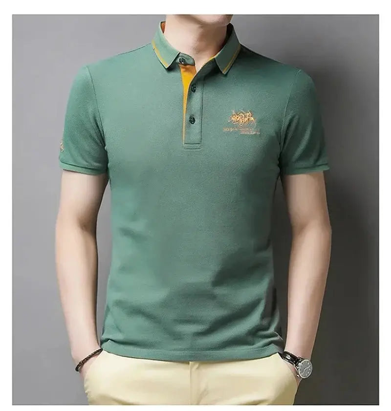 Men's green polo shirt with yellow collar trim and embroidered chest logo; short sleeves.