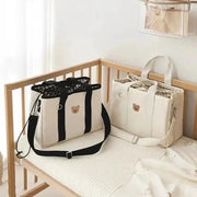 MomEase Medium Sized Diaper Bag With Multiple Compartments Hands Free Hobo Style For On The Go Moms