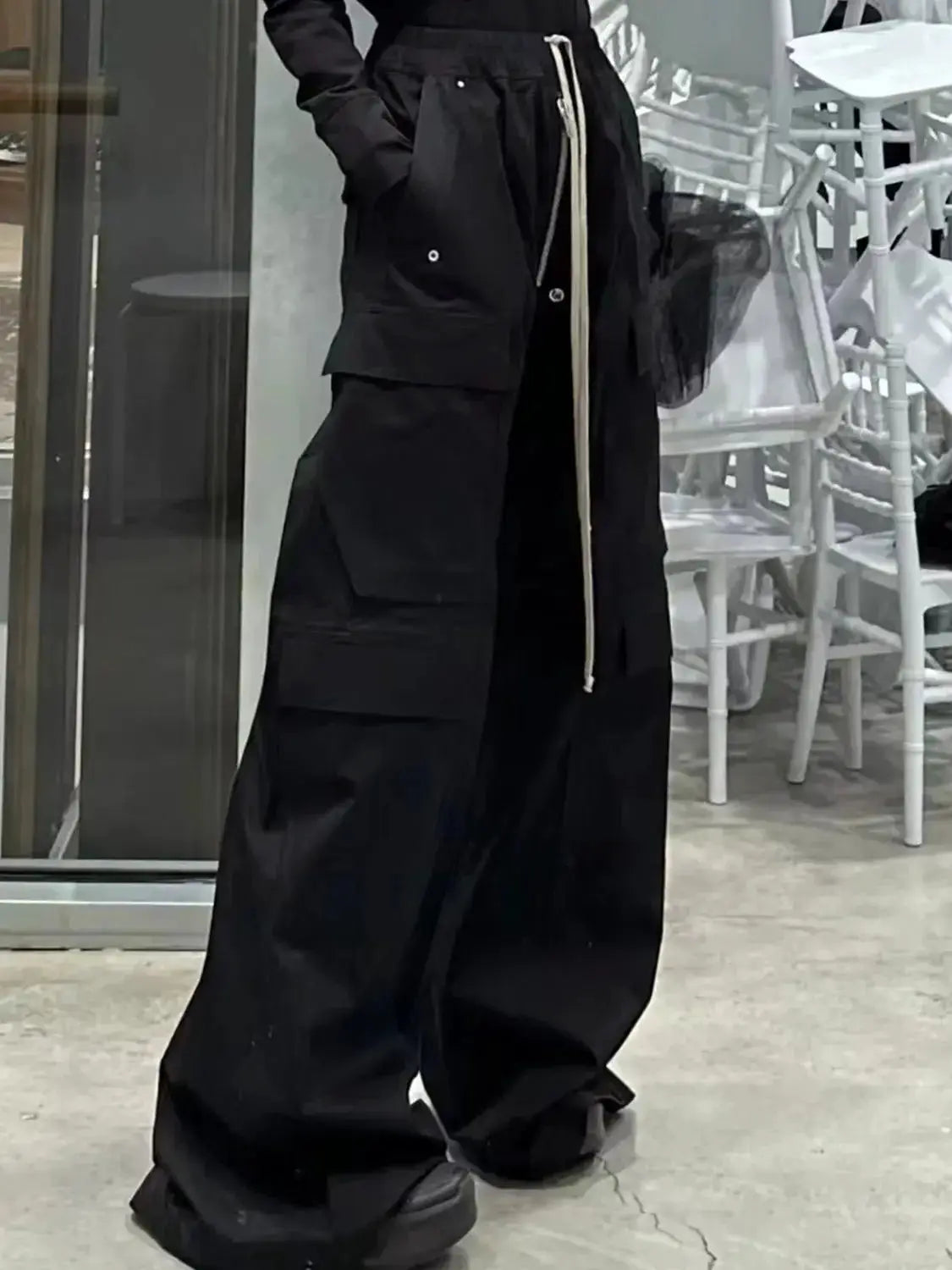 Owen Seak men's black cargo pants, loose fit with multiple pockets and beige drawstring waist