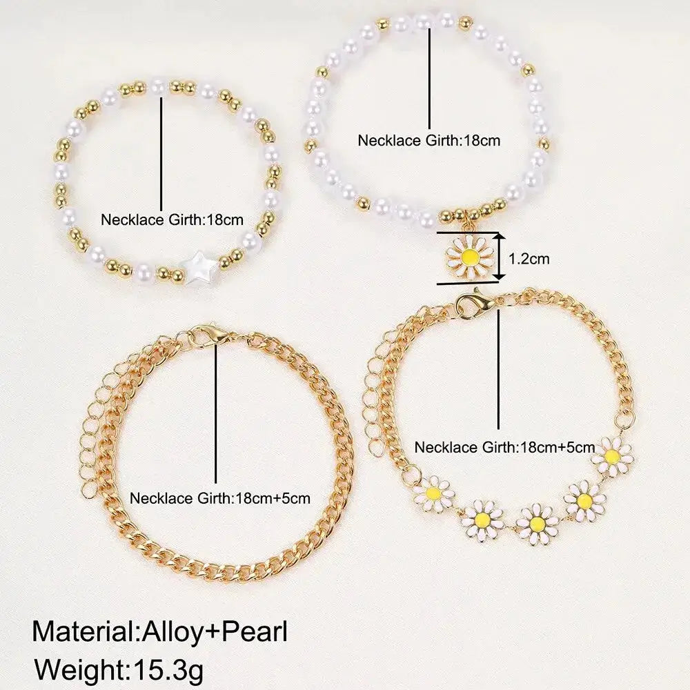 Five-piece girls bracelet set with pearl bead and gold-tone chain bracelets and daisy charms; adjustable lengths