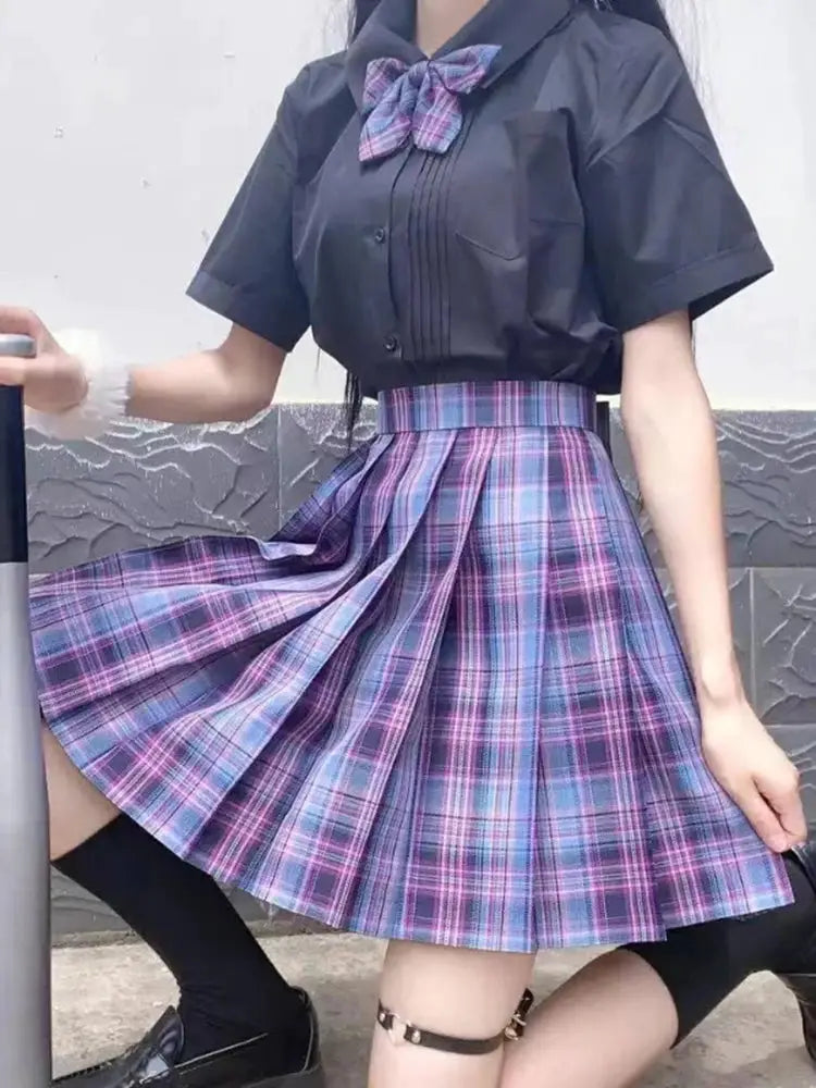 ZOKI plaid pleated high-waist mini skirt, purple plaid, shown with a black short-sleeve blouse and bow