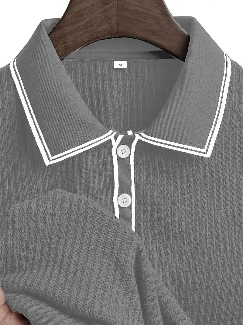 Men's gray polo shirt with short sleeves, white piping on collar, ribbed texture, and button placket.