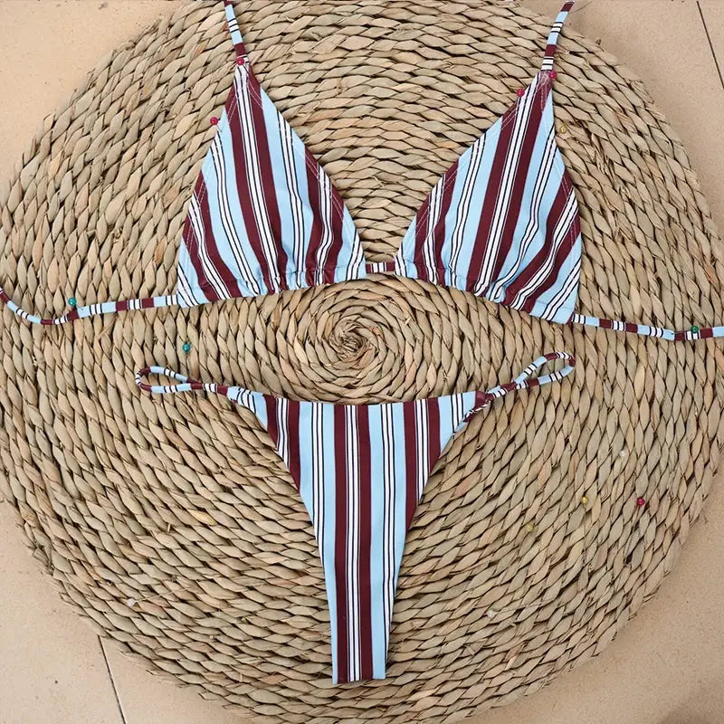 Women's striped bikini set with maroon and light blue stripes; triangle top and string thong bottom.