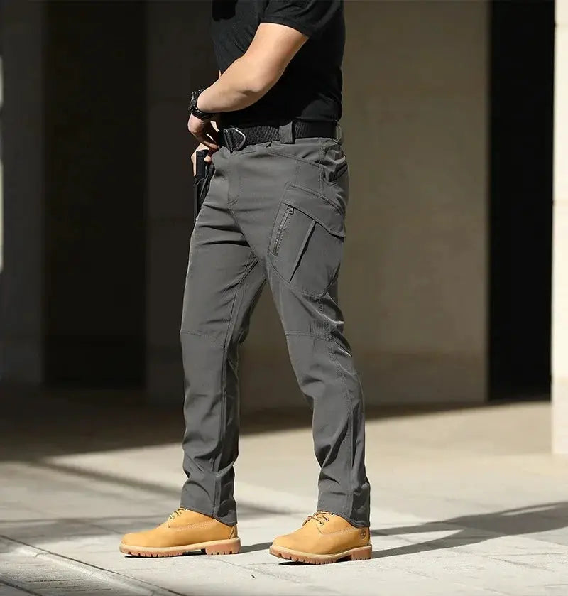 Men's Tactical Cargo Pants by Simples Market in gray softshell with stretch, button fly, and multiple pockets