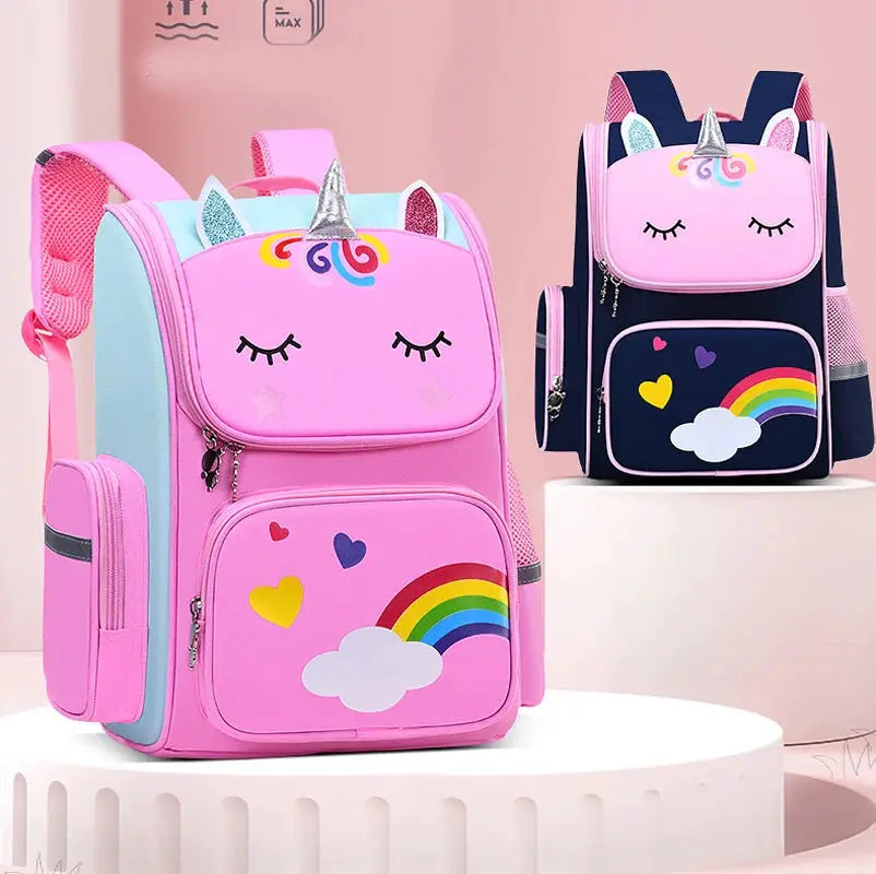 Two unicorn-themed kids' backpacks, pink and navy, with rainbow and cloud motifs; large capacity with pockets.
