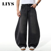 Men's baggy wide-leg black denim jeans, faded wash, front pockets, ankle cuffs