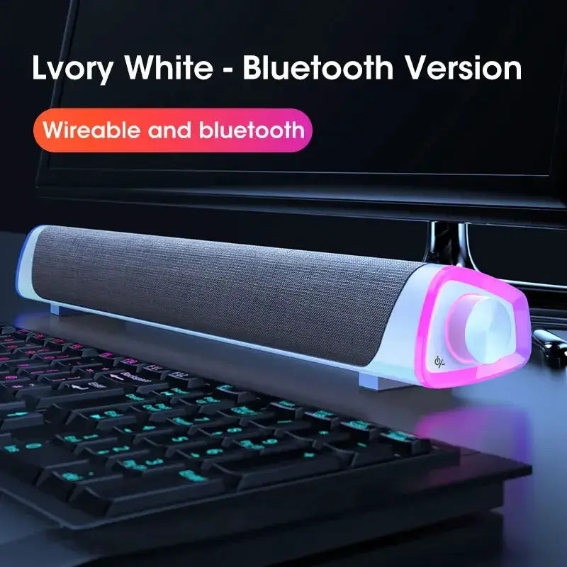 Niye Bluetooth speaker bar with subwoofer in ivory white with pink ends, USB wired desktop audio by Simples Market.