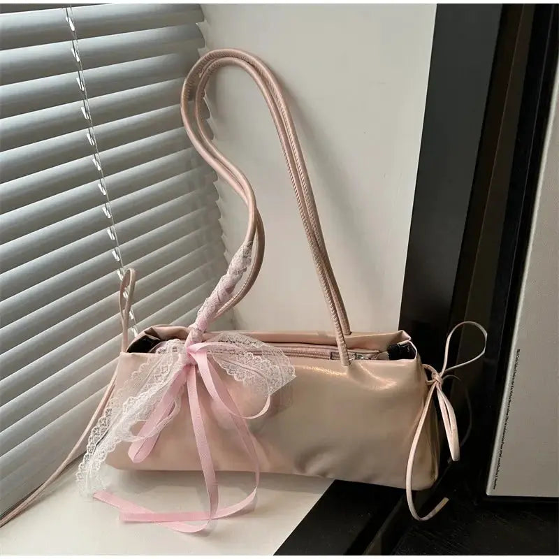 Pink square shoulder bag with lace bow ribbon detail; pale pink faux leather, casual ballet-style women's bag