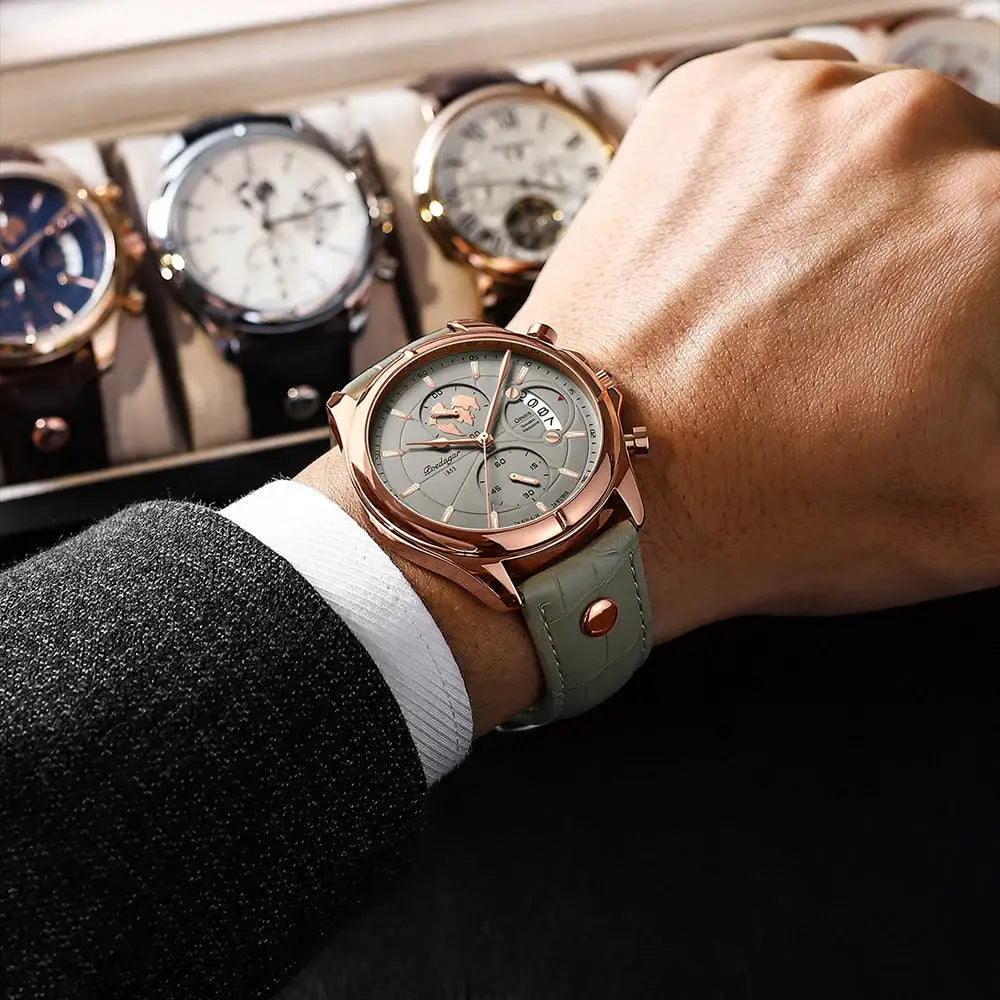 POEDAGAR men's sports chronograph watch on wrist with rose-gold case, gray dial, date window, mint-green leather strap.