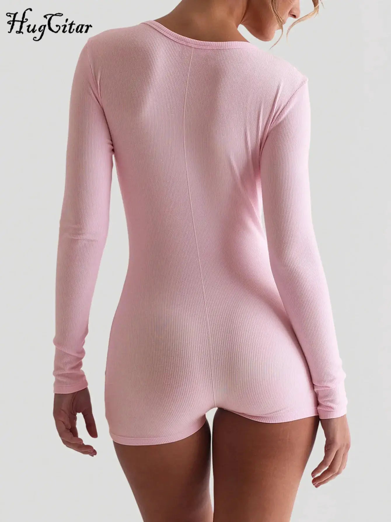 Pink ribbed long-sleeve playsuit; back view, bodycon romper with HugGitar logo