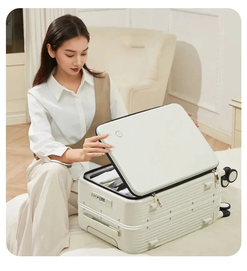 Cream aluminum-frame carry-on suitcase with wheels, lid open