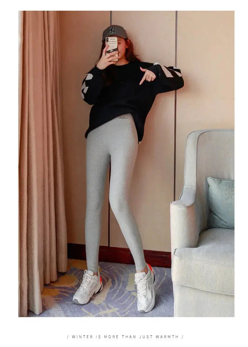 Winter warm women's grey thermal leggings, high-waisted and stretchy for casual fitness.