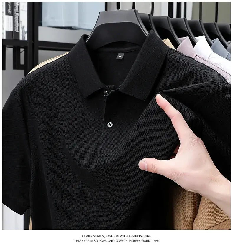 Simples Market men's black polo shirt; 100% cotton polo on a hanger with other colors in the background