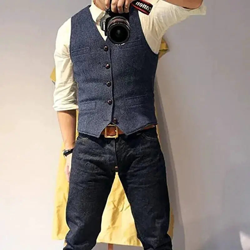 Men's v-neck waistcoat in navy herringbone tweed with brown buttons for a casual formal suit look