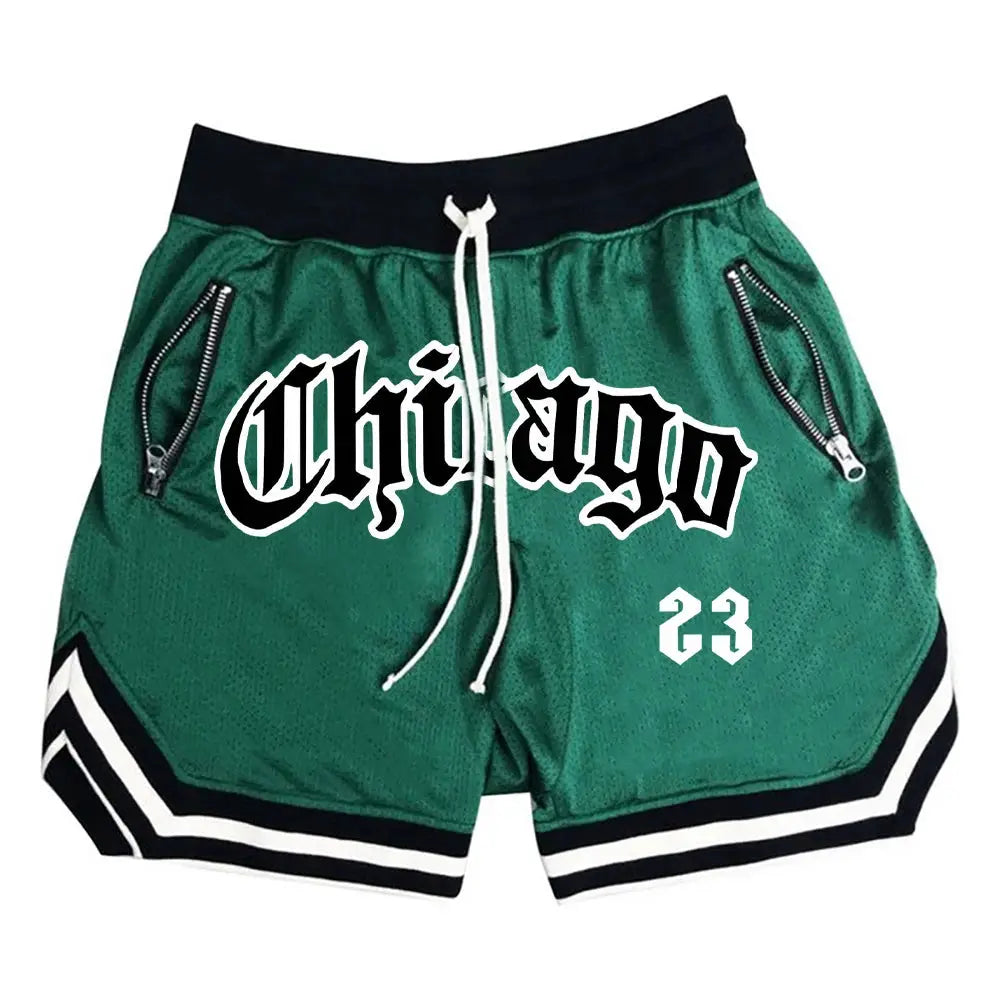 Men's green basketball shorts with black waistband, white drawstring, zip pockets, white striped hems, graphic 23.