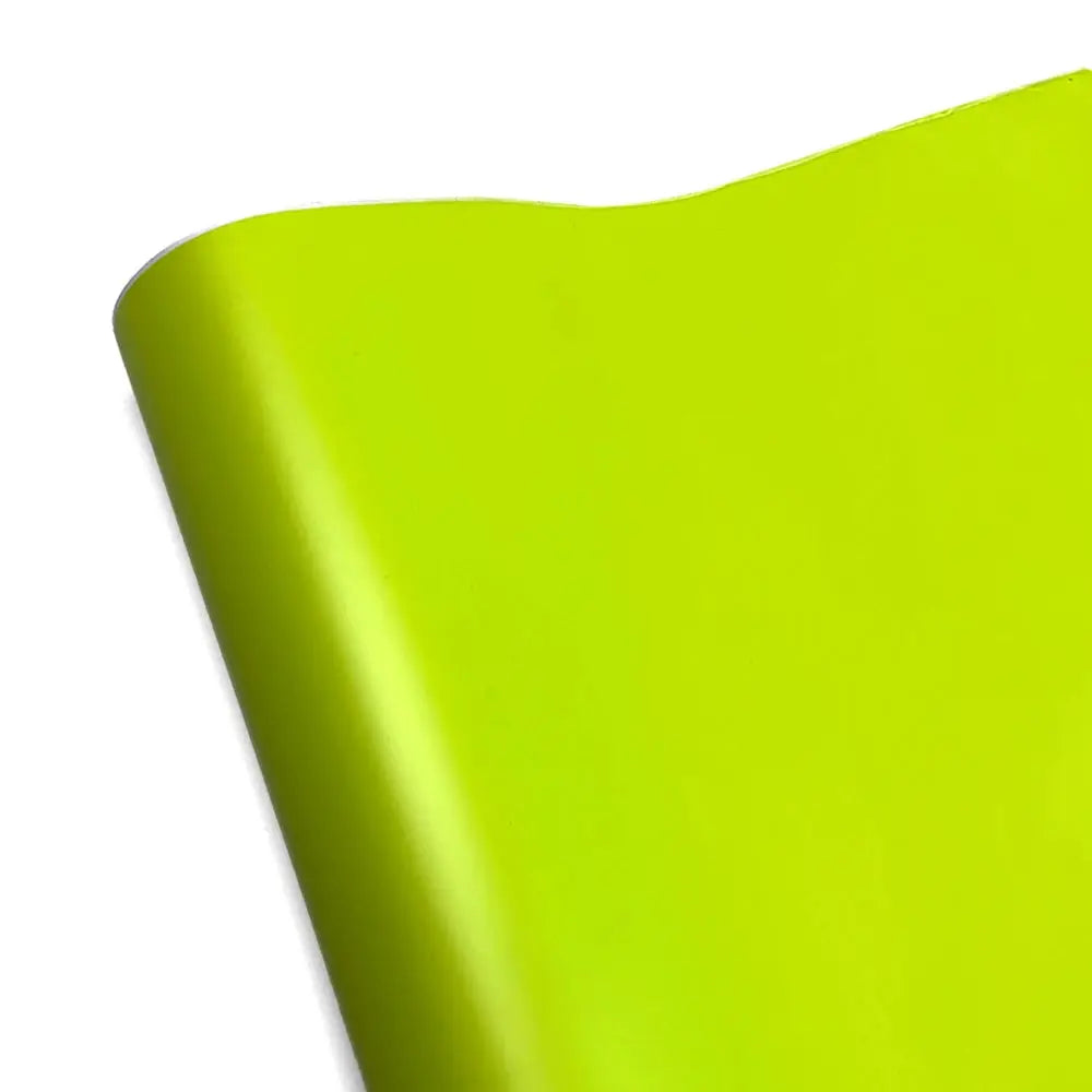 Neon lime vinyl car wrap sheet with rolled corner.