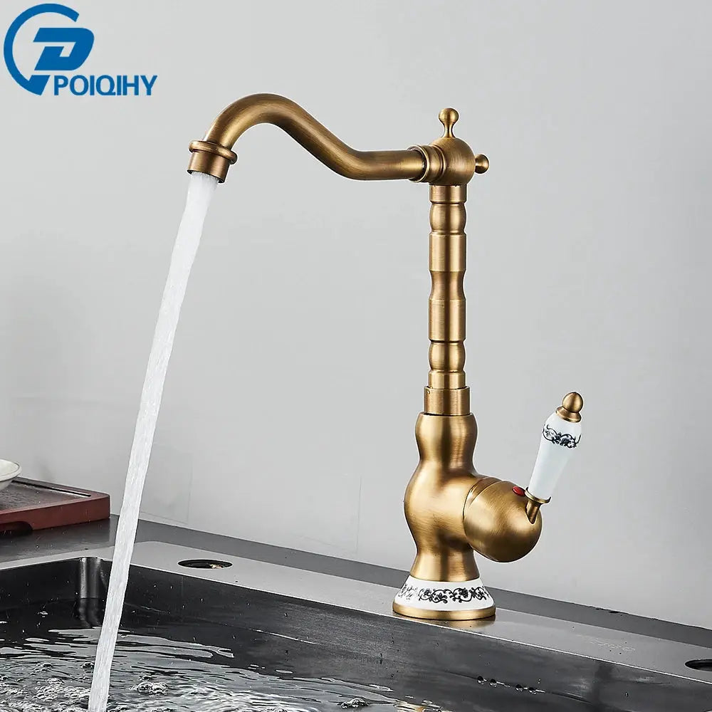 Simples Market antique brass bathroom faucet with rotating spout and ceramic floral handle.