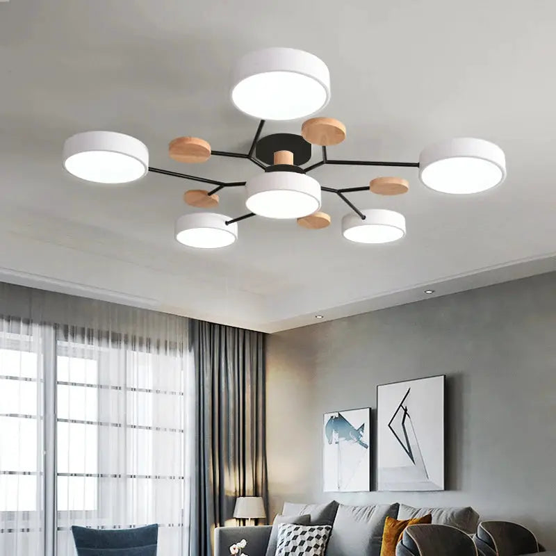 Modern LED chandelier with circular white shade lights, black arms, wood accents