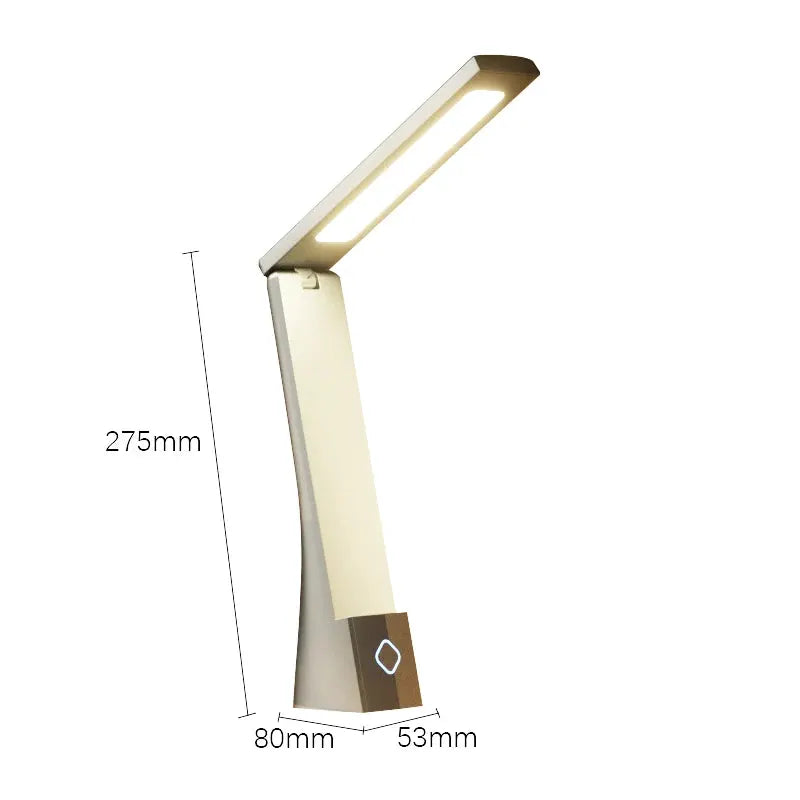 Simples Market LED desk lamp with foldable arm, gold-beige finish and warm white LED light.