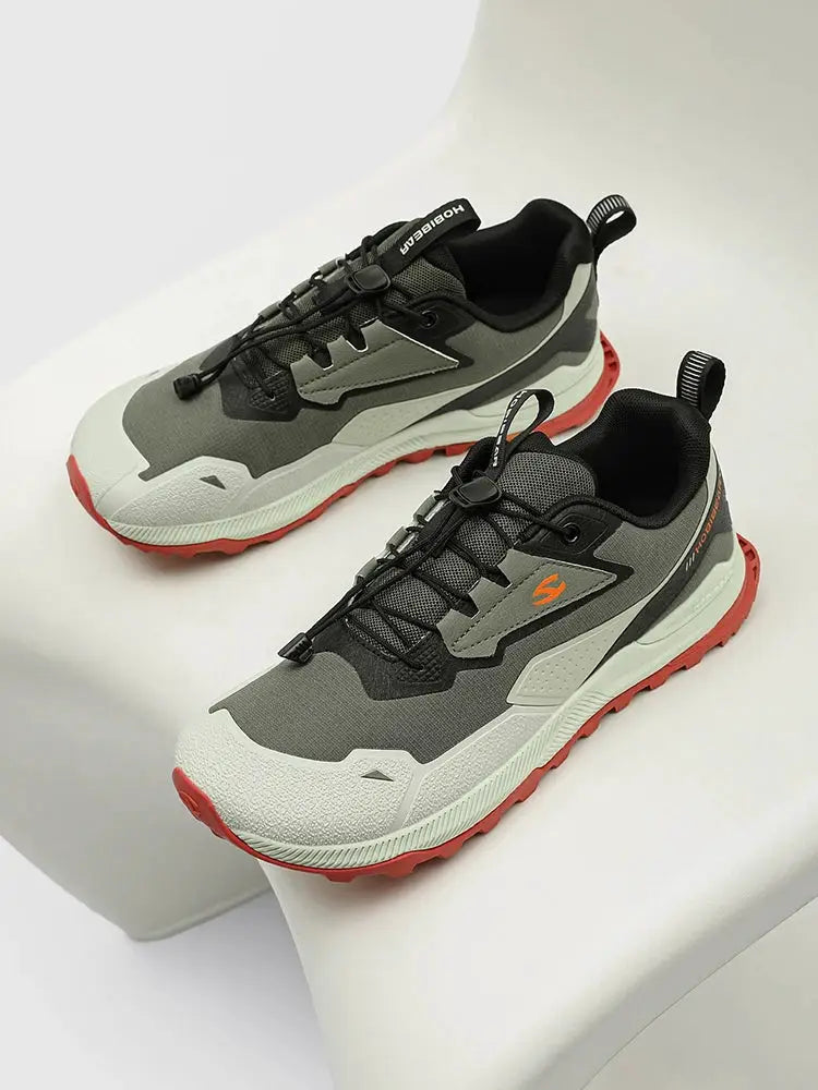 Pair of HOBIBEAR hiking shoes, gray/black with orange outsole, elastic laces, non-slip sole