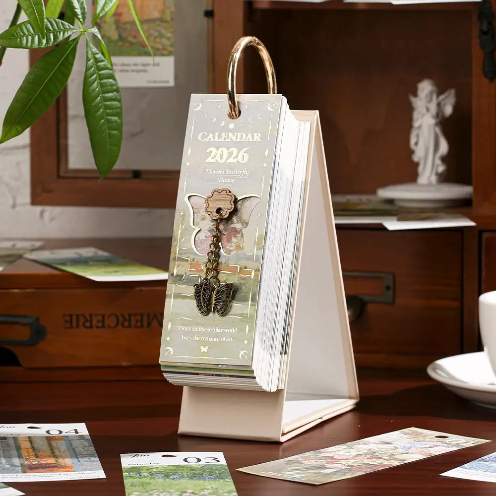 Desk calendar 2026 with gold ring binding, vintage oil-painting design and butterfly charm