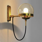Modern glass ball wall lamp with brass finish and black cord, wall-mounted industrial bedside light for living room