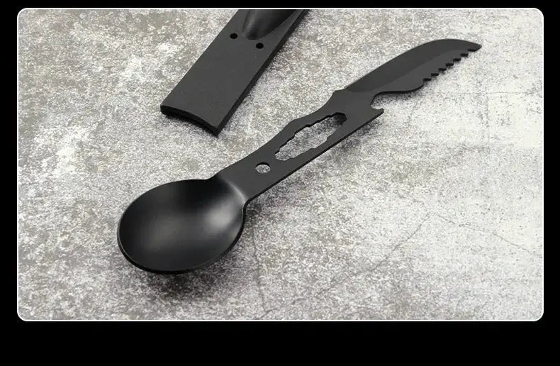 Portable stainless steel camping tool set in black with spoon, fork, and whistle