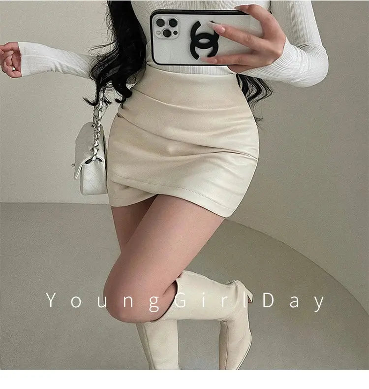 Womens PU leather wrap mini skirt, beige high-waist A-line with wrinkle detail.