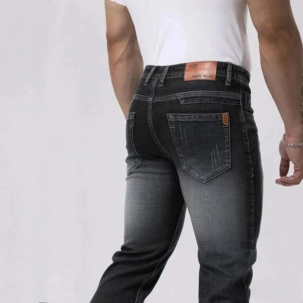 Men's jeans by Simples Market; dark denim wash with leather waistband patch and back pocket stitching