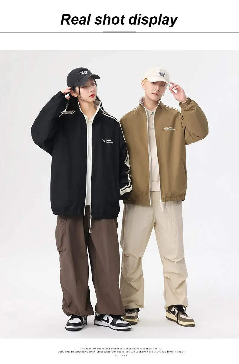 Two-sided reversible outdoor jackets by Simples Market; black and khaki windproof coats worn by a couple.