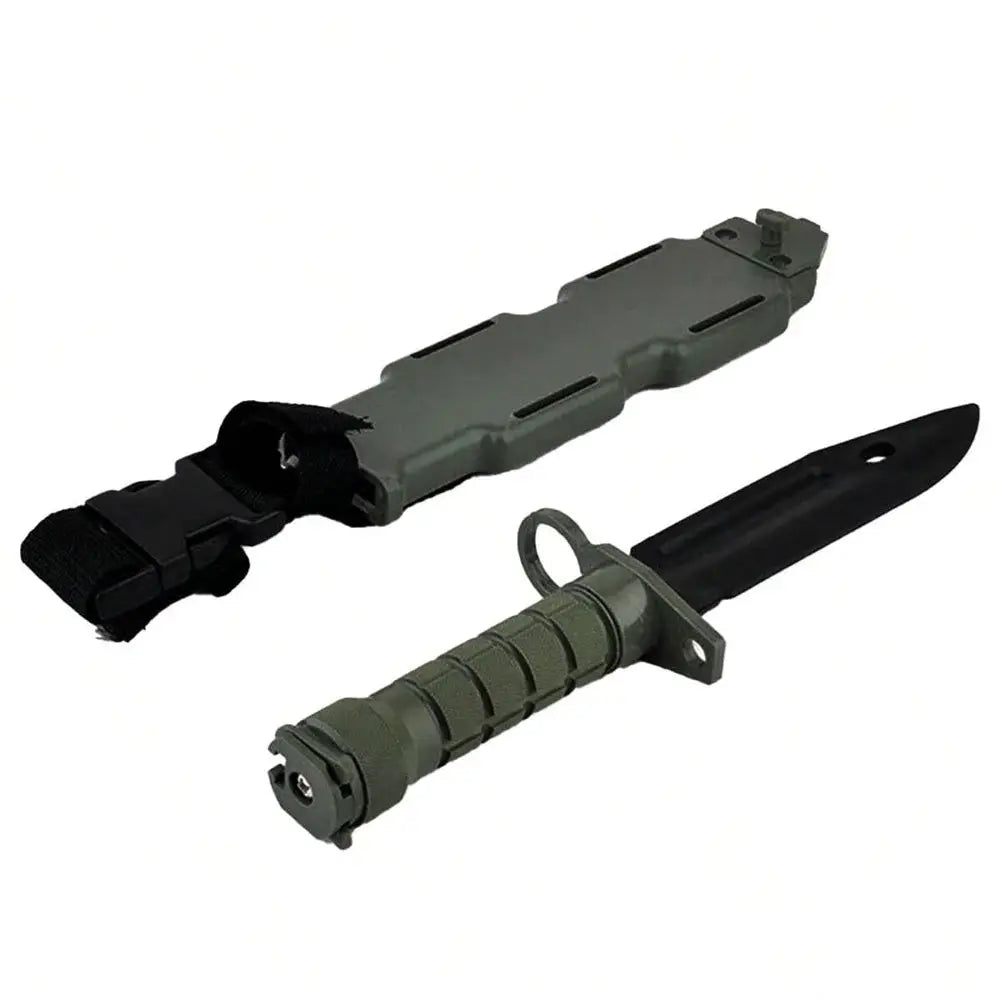M9 tactical rubber knife with textured green grip and black blade, includes matching green sheath