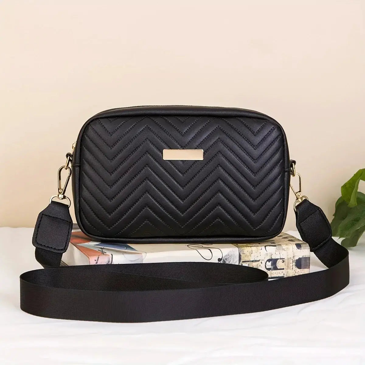 Minimalist black quilted PU crossbody bag with chevron pattern and detachable strap