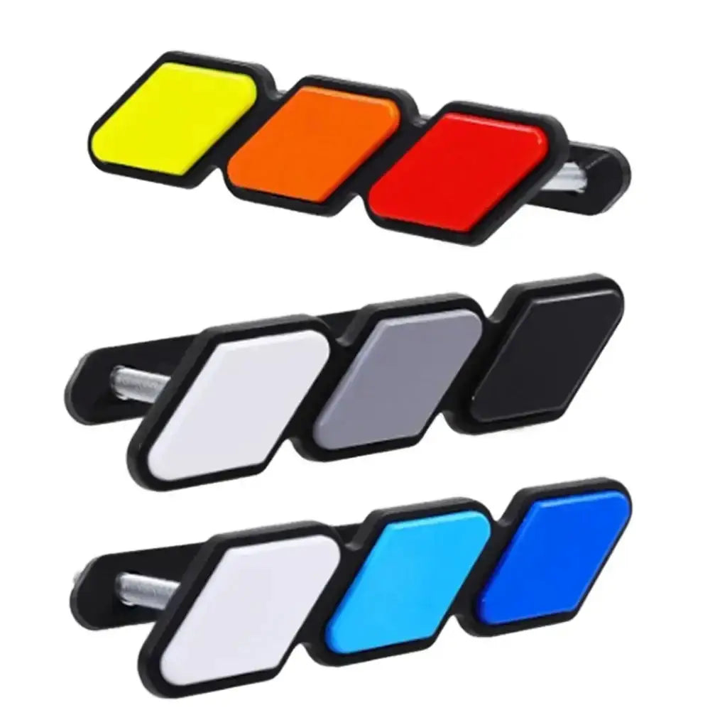 Simples Market 3-color grille badge emblems; three panel badges with colored squares for Toyota.