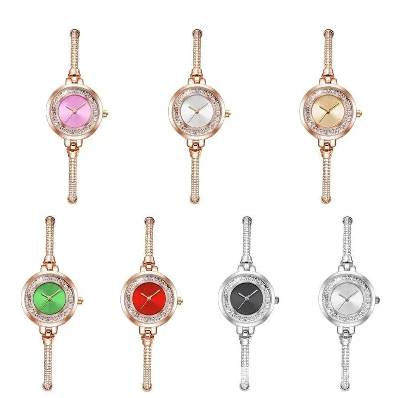 Eight women's quartz wristwatches with crystal-bezel and gold/silver steel bracelets in assorted dial colors.