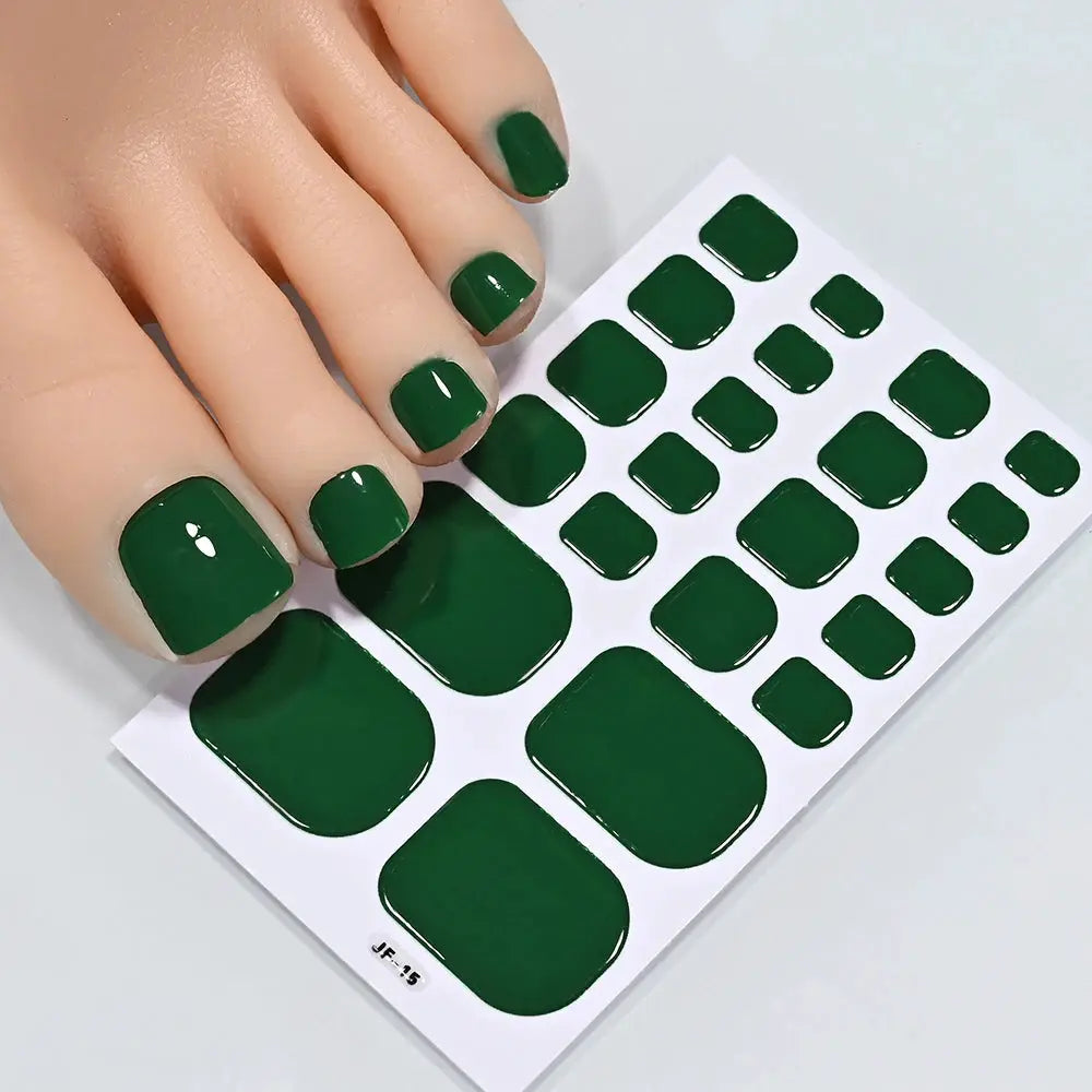 Toe nail sticker wraps sheet in solid dark green; full-coverage, self-adhesive toenail decals, multiple sizes.