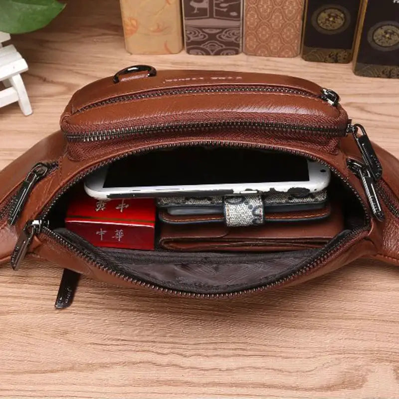 Genuine leather brown waist fanny pack by Simples Market; travel-ready bag with multiple zip pockets.