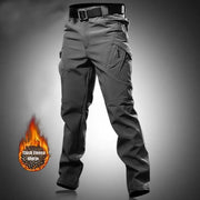 Men's Simples Market cargo softshell hiking pants, dark gray fleece-lined with multiple zip pockets.