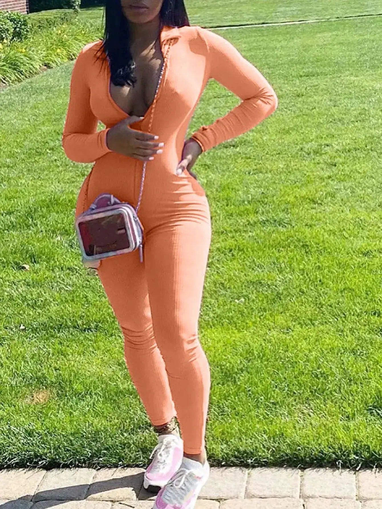 Peach knit jumpsuit for women, long-sleeve bodycon style with fitted silhouette
